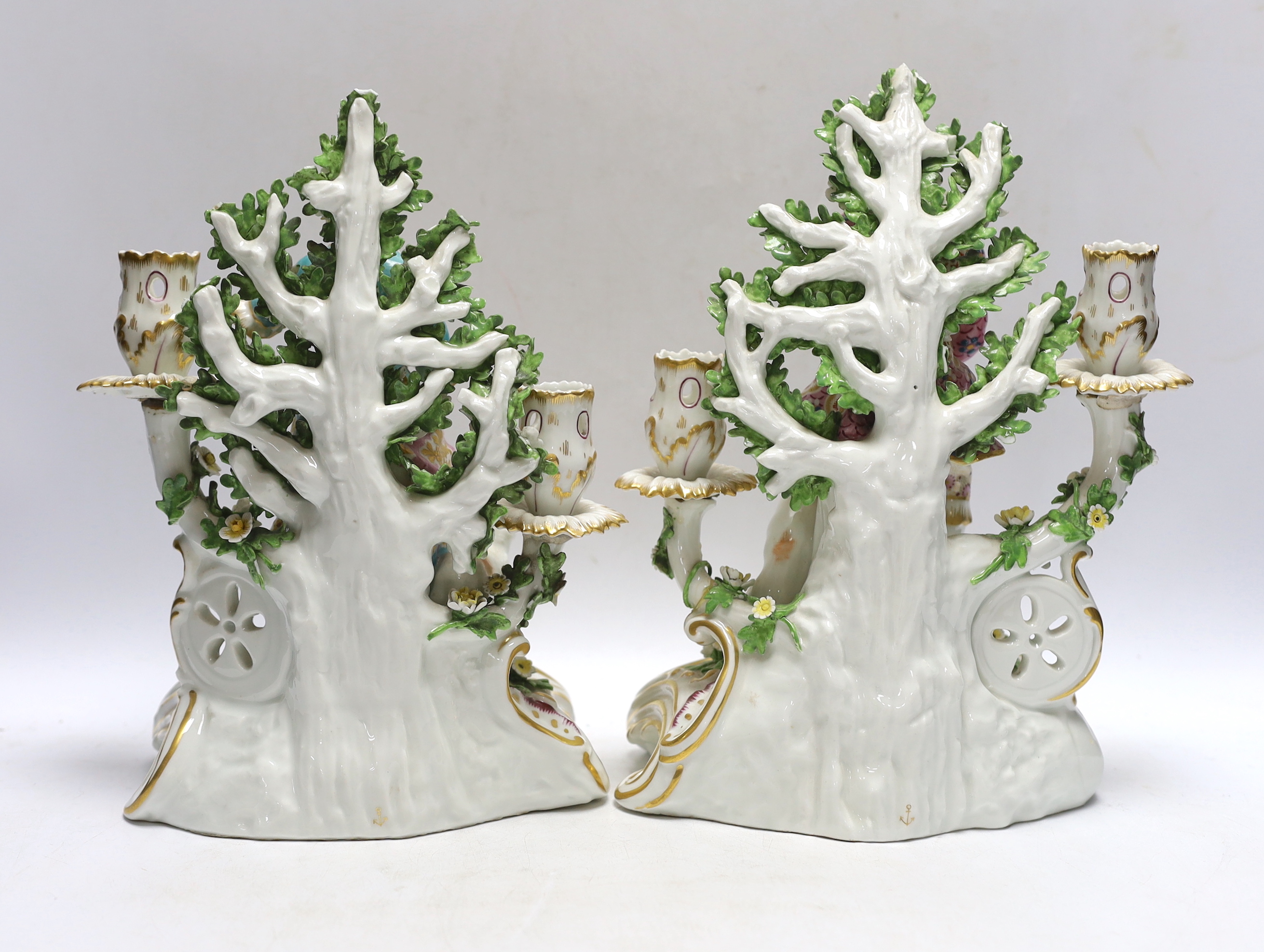 A pair of late 19th century Samson figural porcelain candle holders, 26cm
